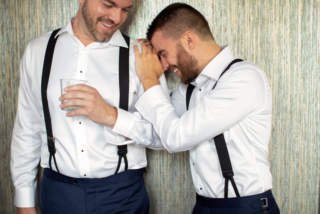 grooms are happy and smiling on wedding day