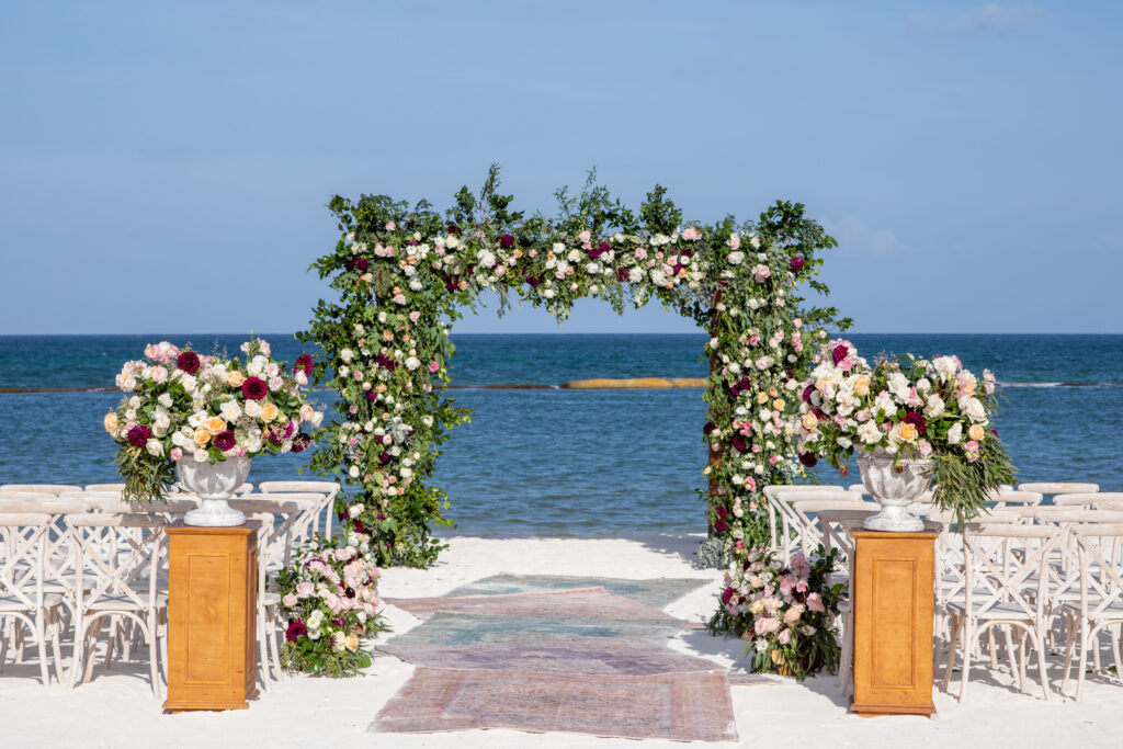 Wedding ceremony setup with roses at destination beachfront wedding in Andaz Mayakoba, Mexico.