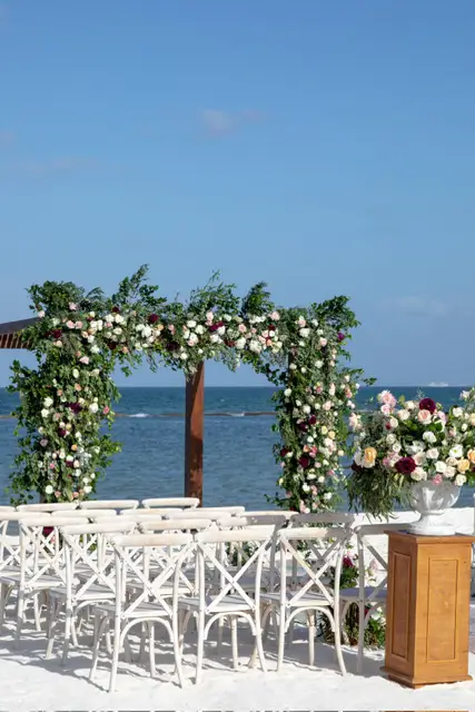 Wedding ceremony setup with roses at destination beachfront wedding in Andaz Mayakoba, Mexico.