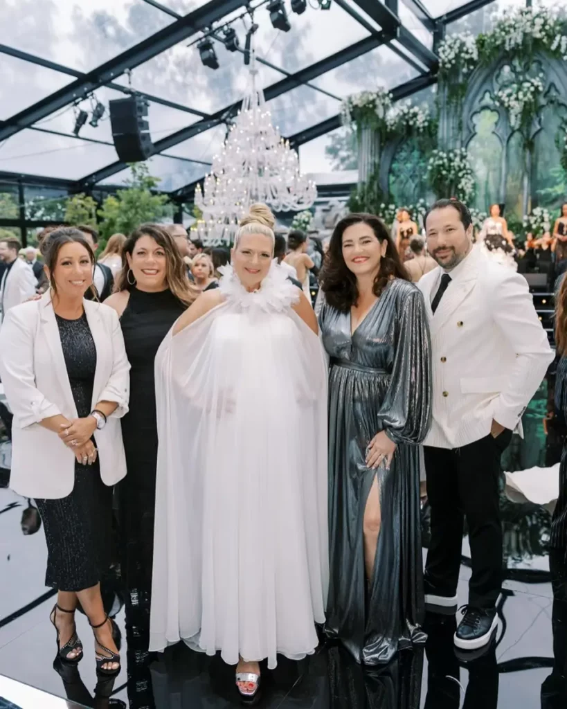 Attendees of Engage Luxury Business Summit 2024 in Nemacolin posing for a portrait wearing gala attire.