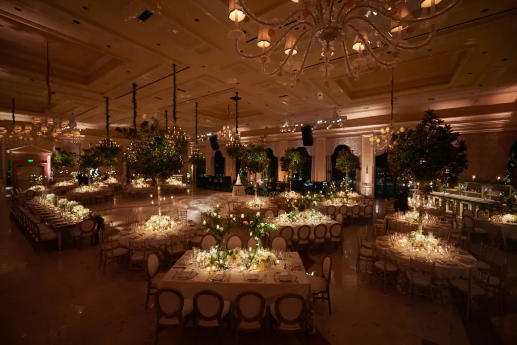 The Breakers Palm Beach luxurious wedding ceremony with tall table decor and candlelight setting.