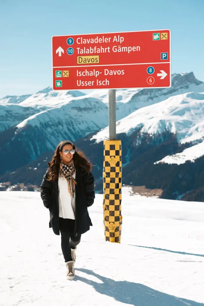 Michelle Durpetti standing at Fuxaguger in front of snowy mountain.